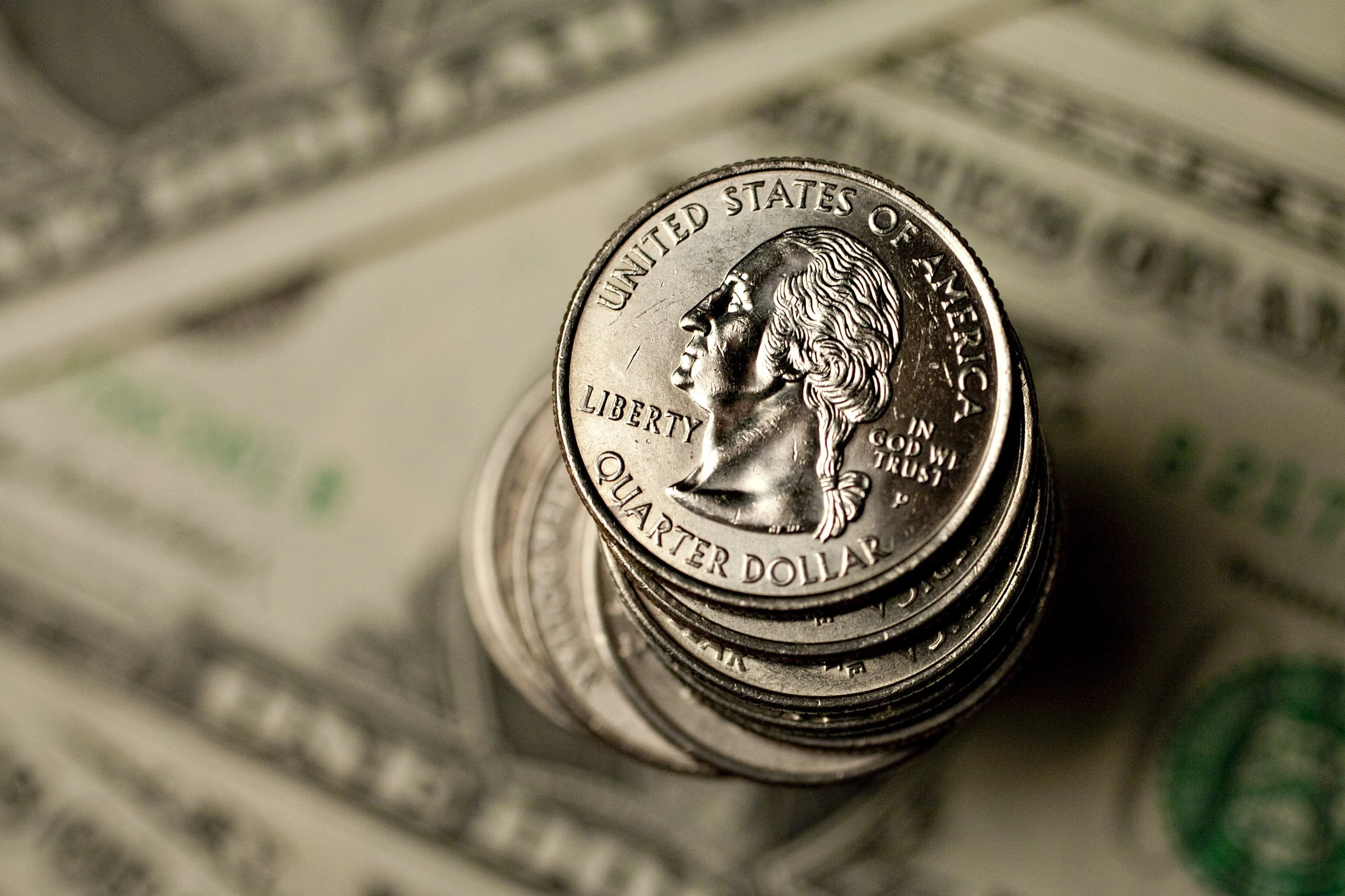 U.S. quarters and U.S. dollar bills