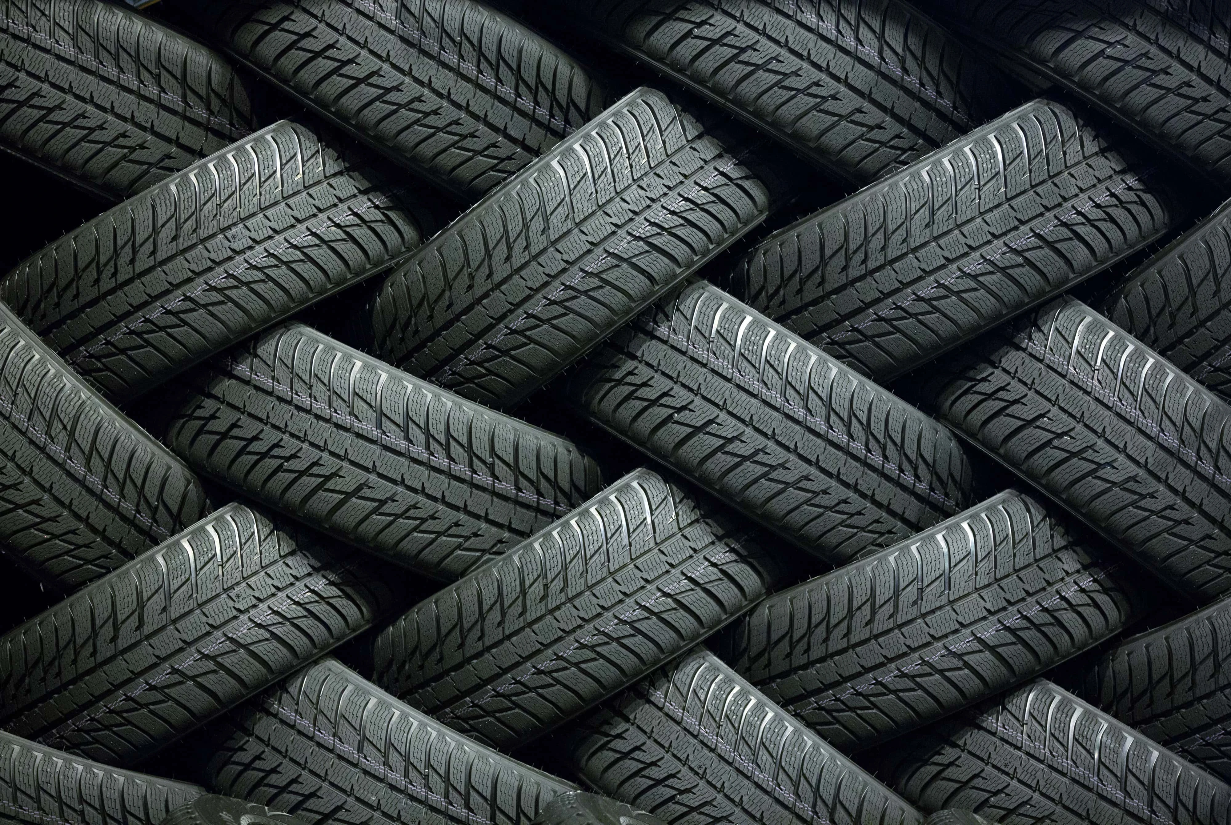 Finished tires sit in a storage area