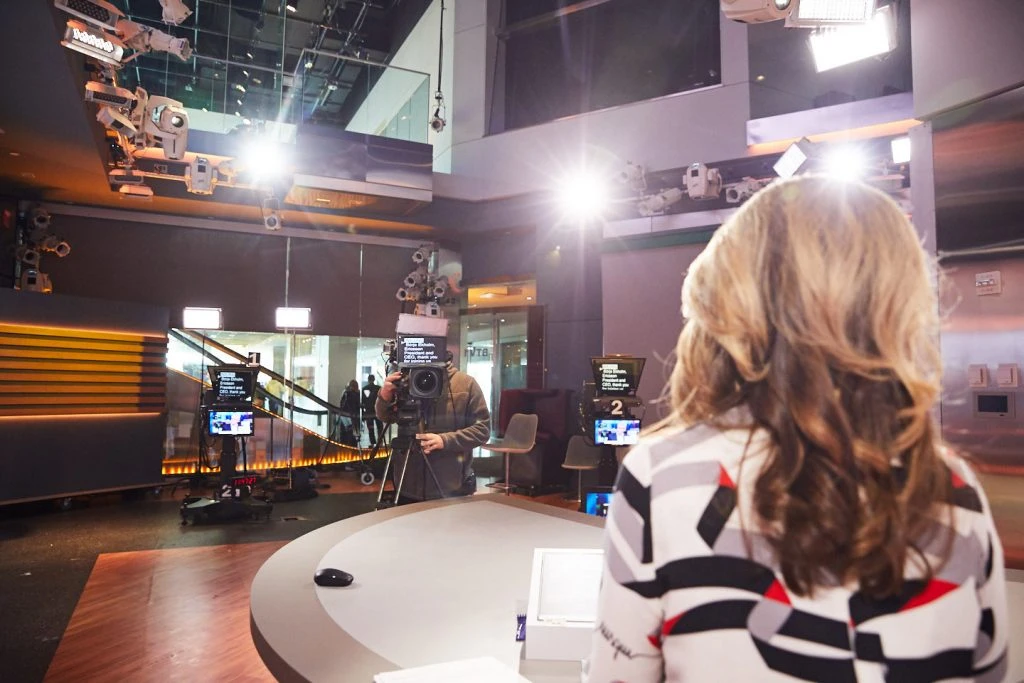 Bloombergs-Diversity-in-Media-Training-Program A woman reports financial news in one one of the Bloomberg TV studios.