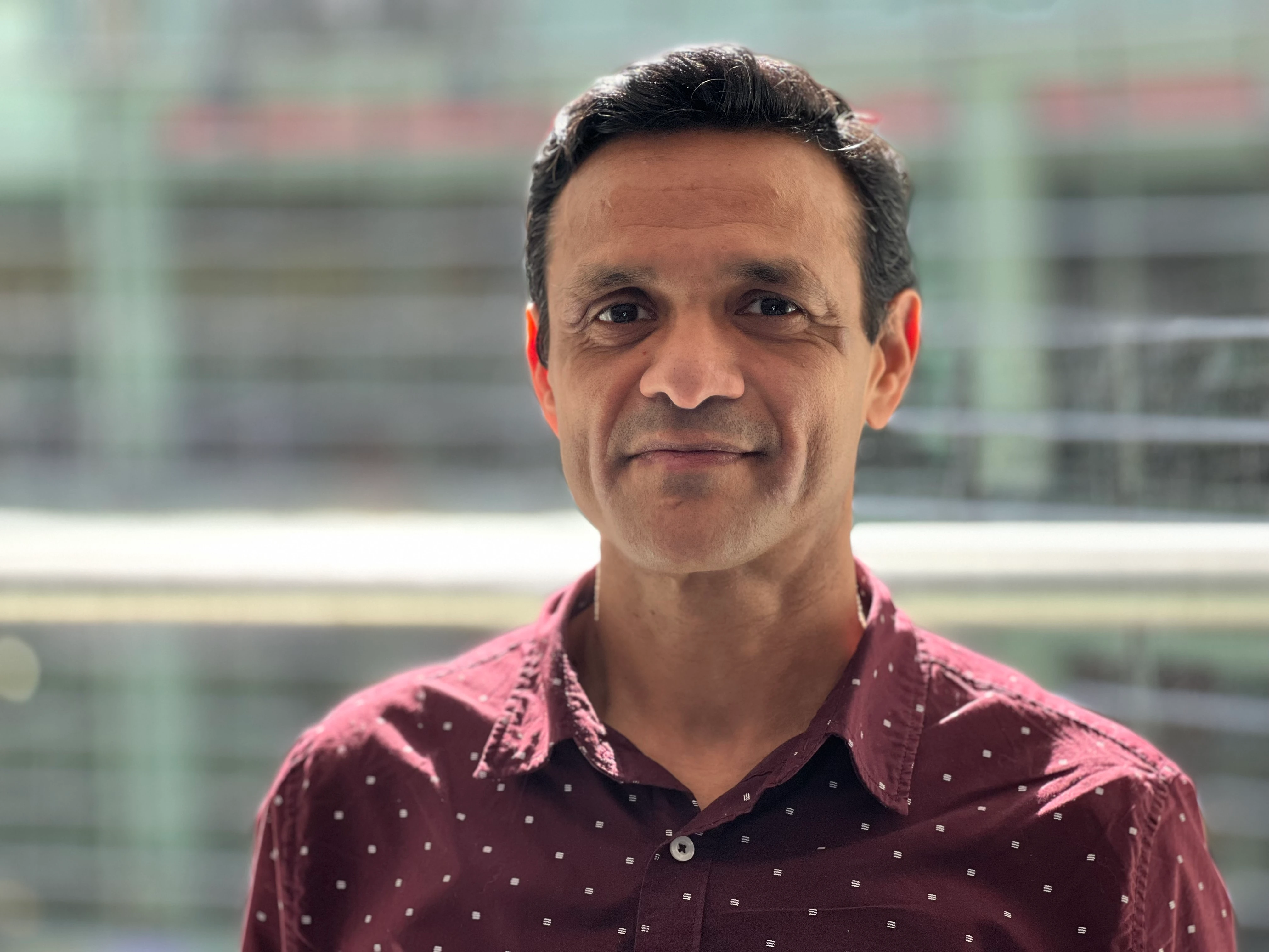 Saurabh-Agarwal Saurabh Agarwal standing in front of the windows in the Bloomberg office in NYC