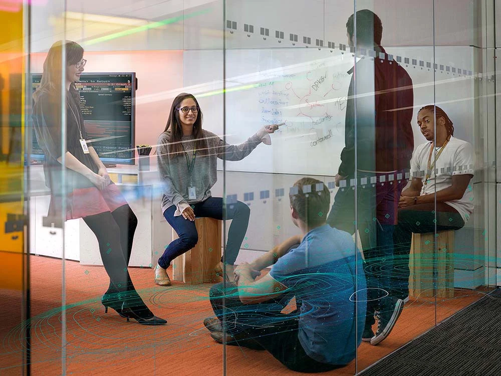 A-diverse-tech-team-at-Bloomberg-has-a-brainstorming-session-about-system-architecture A diverse tech team at Bloomberg has a brainstorming session about system architecture.