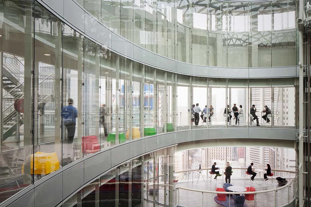An-important-part-of-Bloombergs-leadership-in-financial-data-and-news-services-is-our-beautiful-office-in-Sydney-Australia Bloomberg's Australia office is Sydney is a glass ring enclosing a courtyard and houses open coworking spaces on every floor.