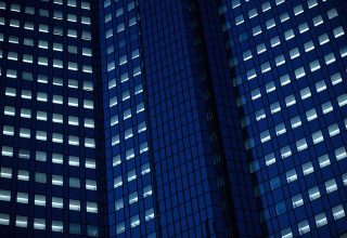 Office windows sit illuminated Office windows sit illuminated in Germany. Photographer: Krisztian Bocsi/Bloomberg