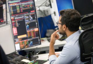 Traders monitor financial data