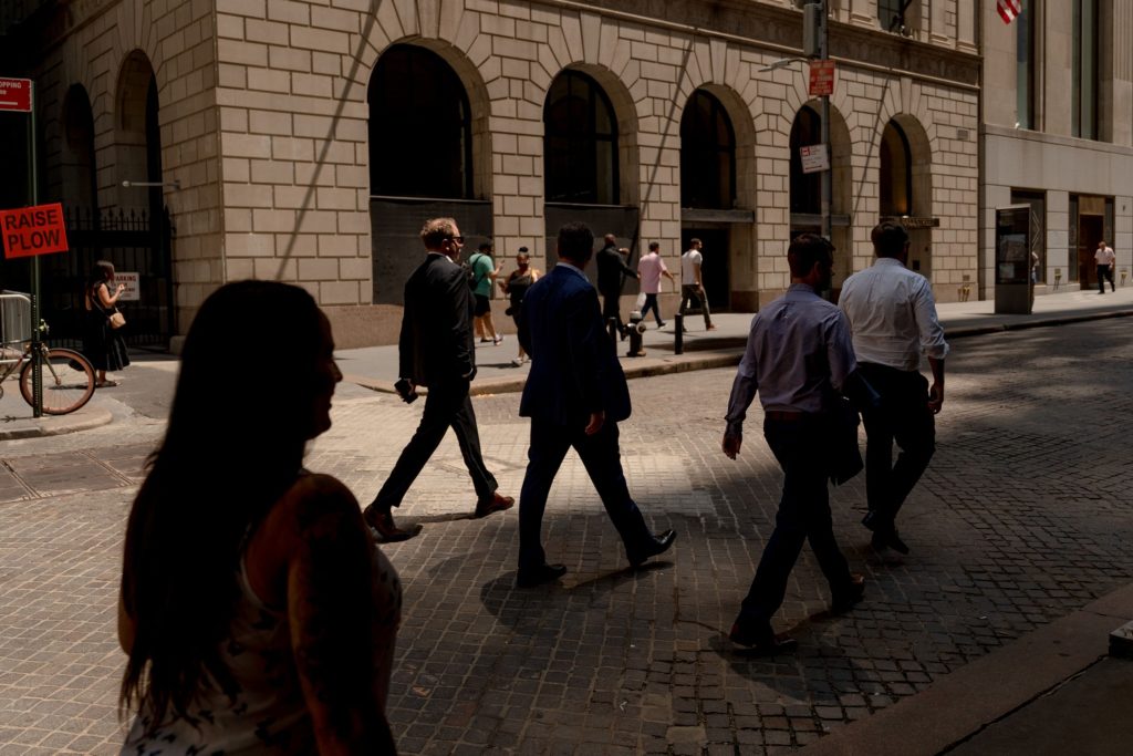 Pedestrians on Wall Street near the New York Stock Exchange