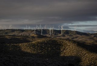 Wind turbines in an undulating landscape. Photographer: Angel Garcia/Bloomberg